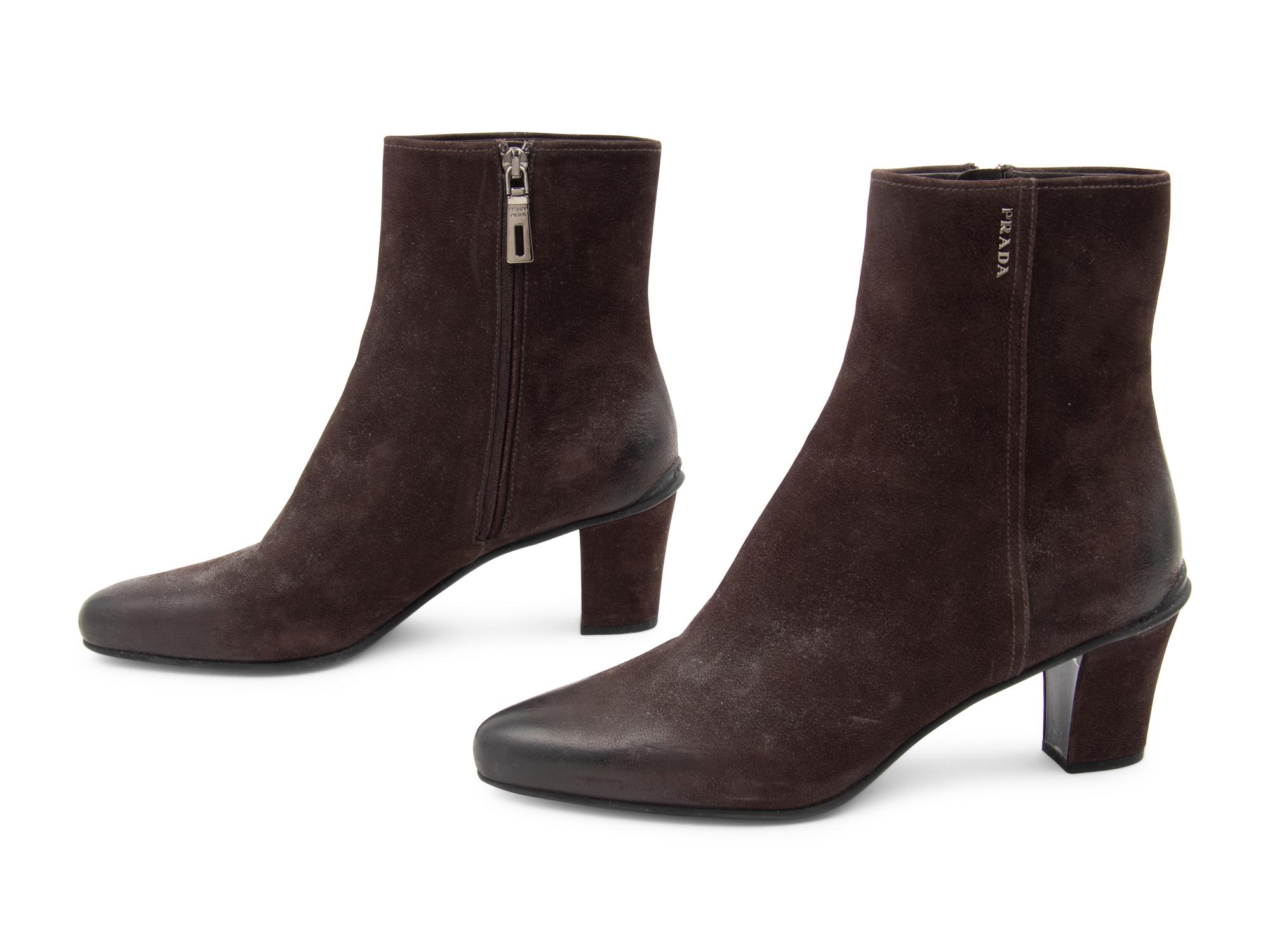 Three Pairs of Designer Boots: One Chanel, One Prada, One Celine