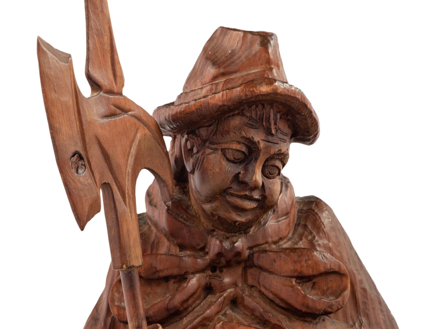 A Black Forest Carved Walnut 'Night Watchman' Lamp