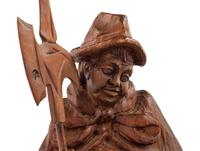 A Black Forest Carved Walnut 'Night Watchman' Lamp