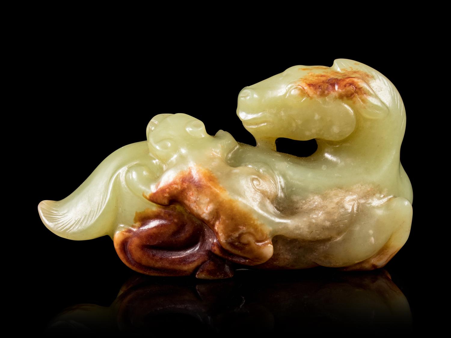 A Celadon and Russet Jade Horse