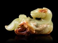 A Celadon and Russet Jade Horse