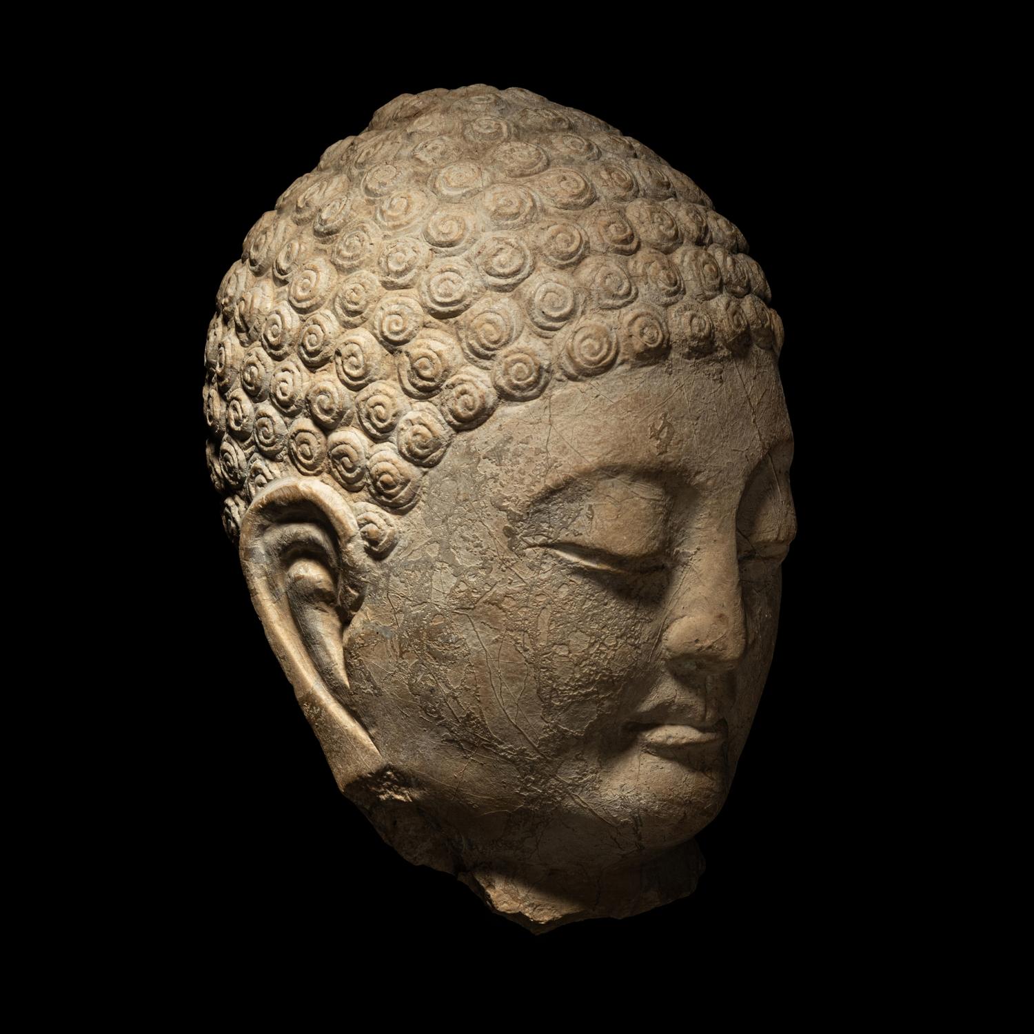 A Carved Stone Head of Buddha
