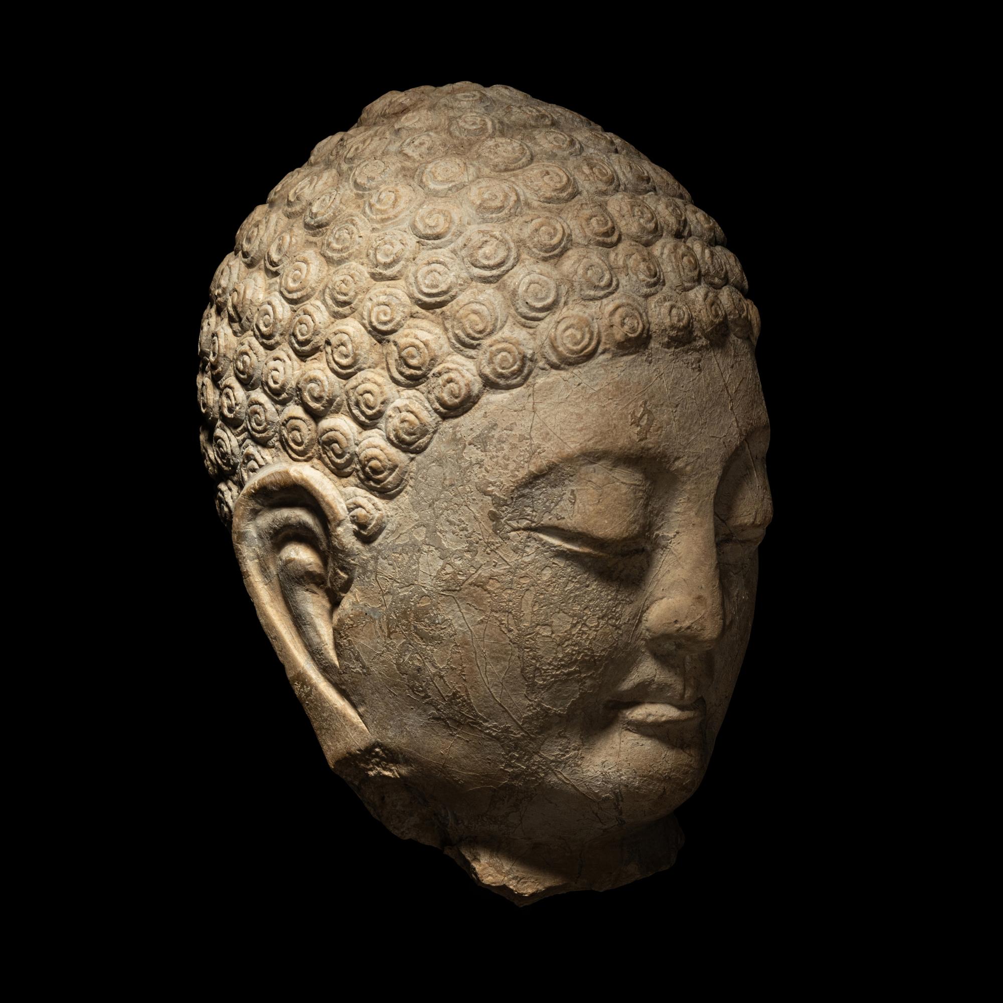 A Carved Stone Head of Buddha