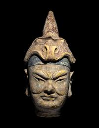A Polychrome Stucco Head of a Temple Guardian