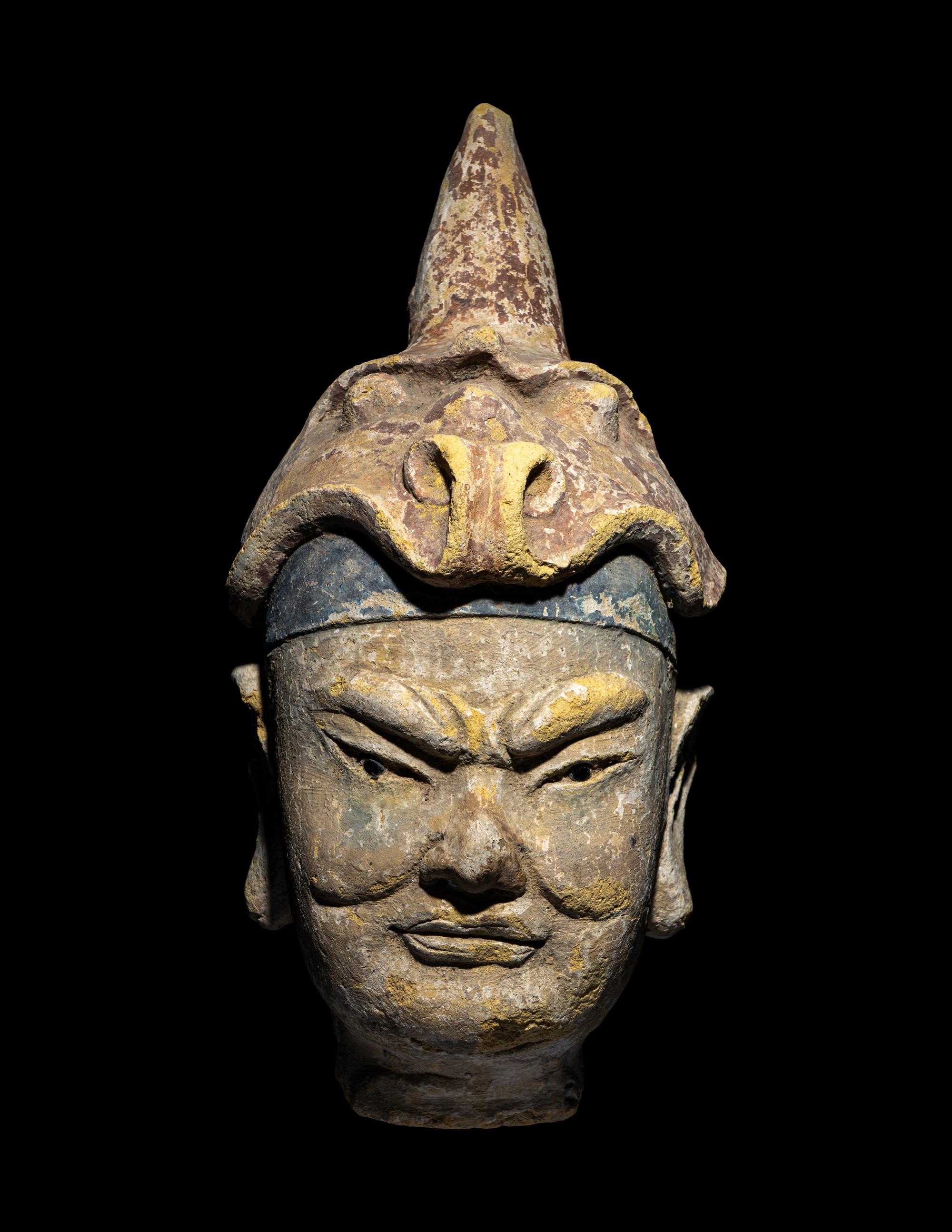 A Polychrome Stucco Head of a Temple Guardian