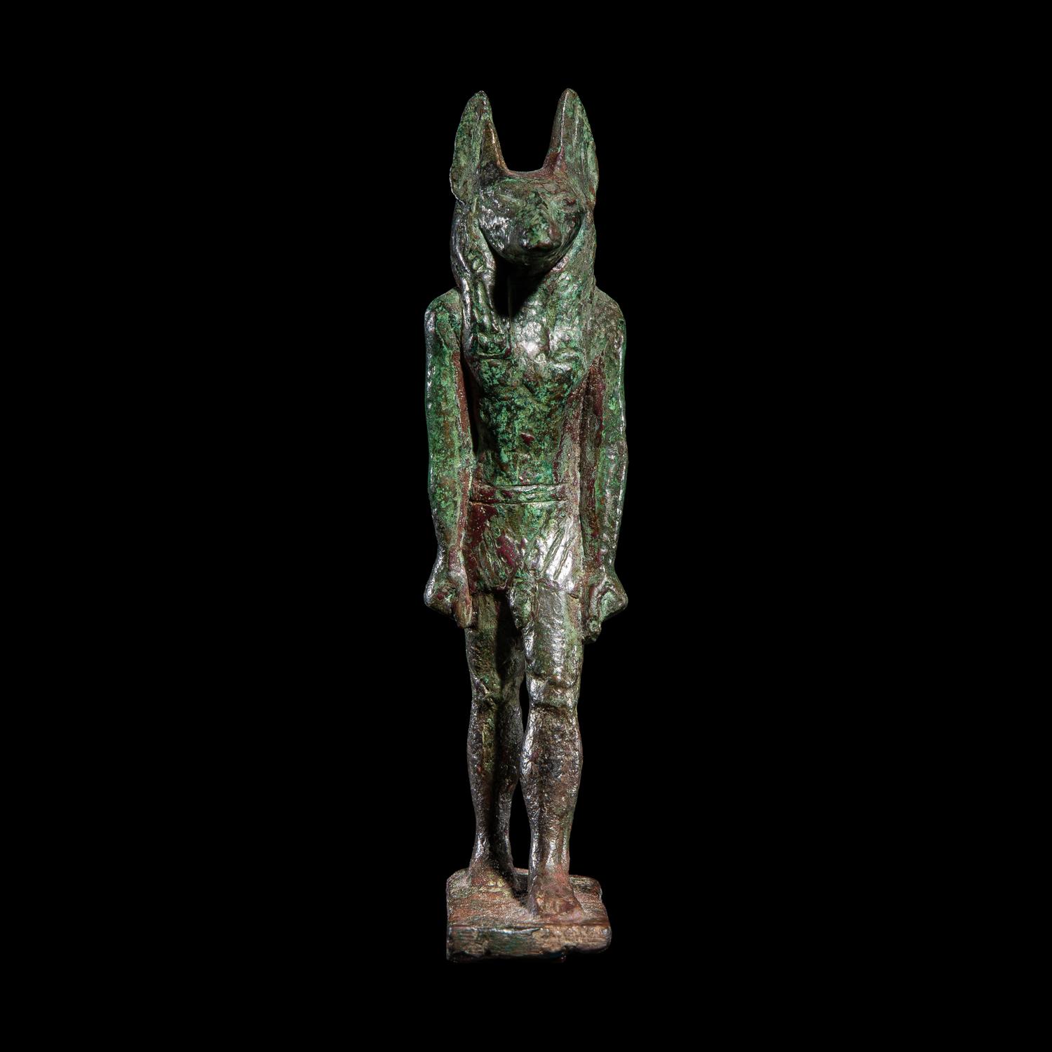 An Egyptian Bronze Striding Anubis