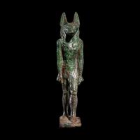 An Egyptian Bronze Striding Anubis