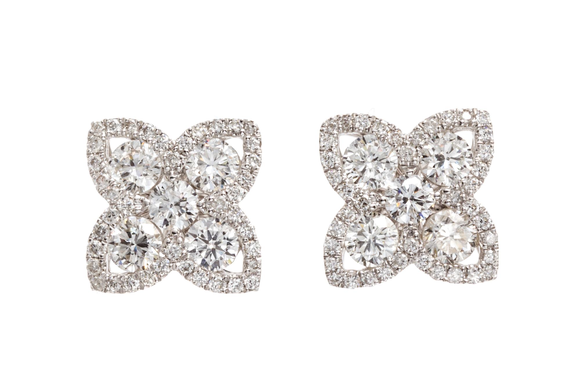 A Pair of 18 Karat White Gold and Diamond Cluster Earrings, 1.80 dwts.