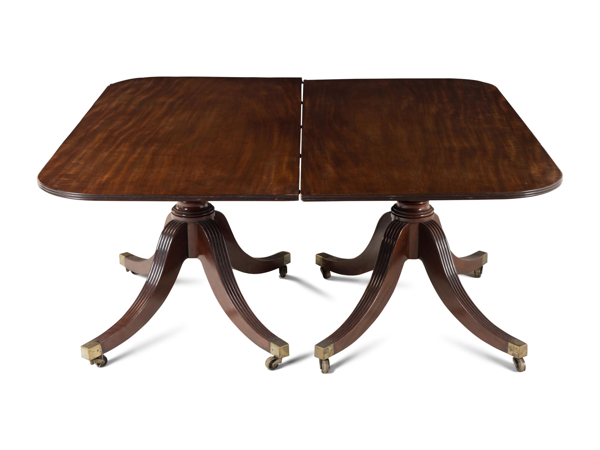 A Regency Mahogany Triple Pedestal Dining Table