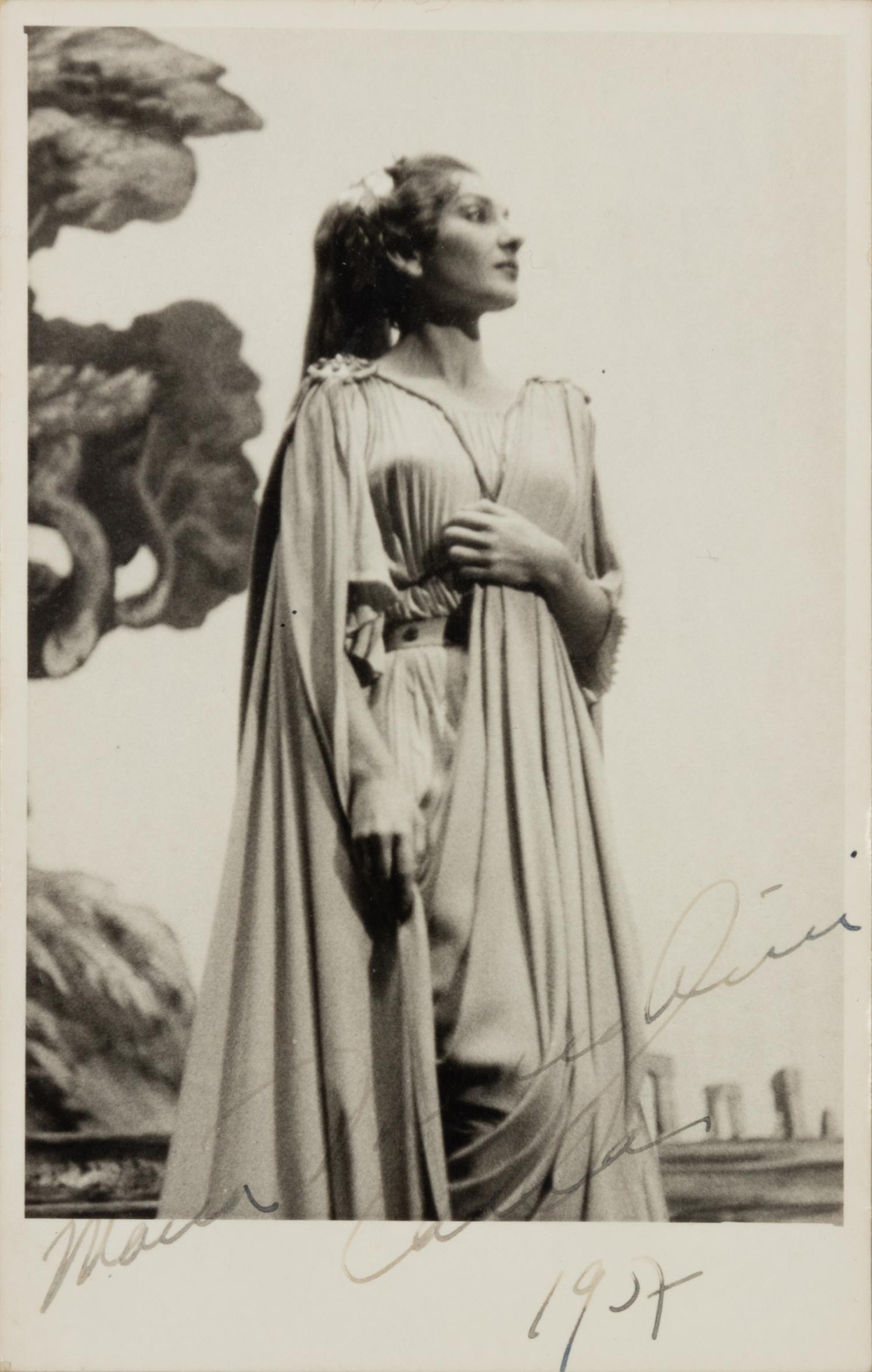 CALLAS, Maria (1923-1977). Black and white photographic portrait, signed (“Maria Meneghini Callas”), 1957.