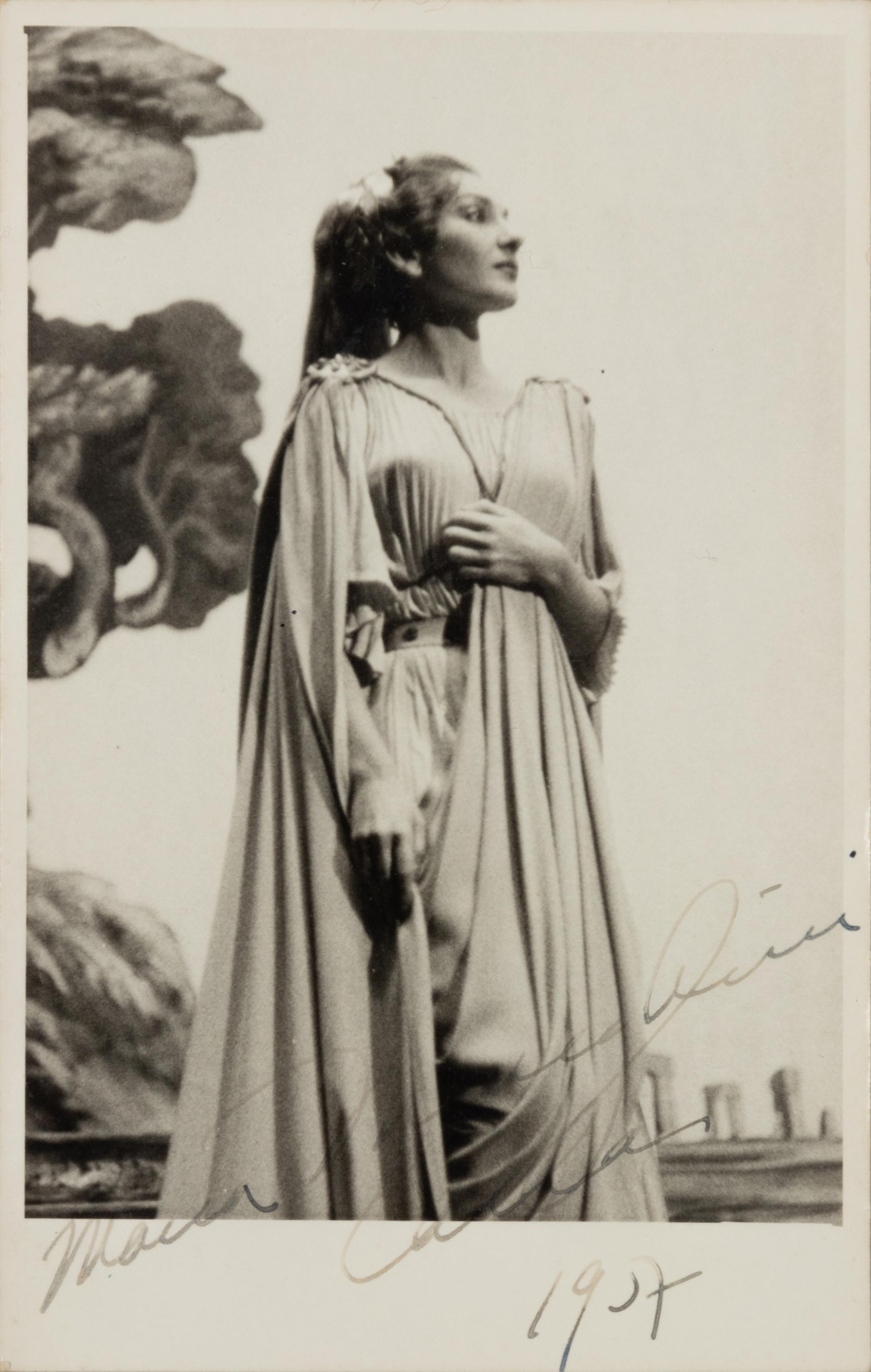 CALLAS, Maria (1923-1977). Black and white photographic portrait, signed (“Maria Meneghini Callas”), 1957.