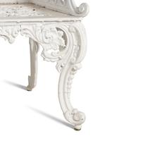 A White-Painted Cast Iron Three-Piece Garden Seating Suite