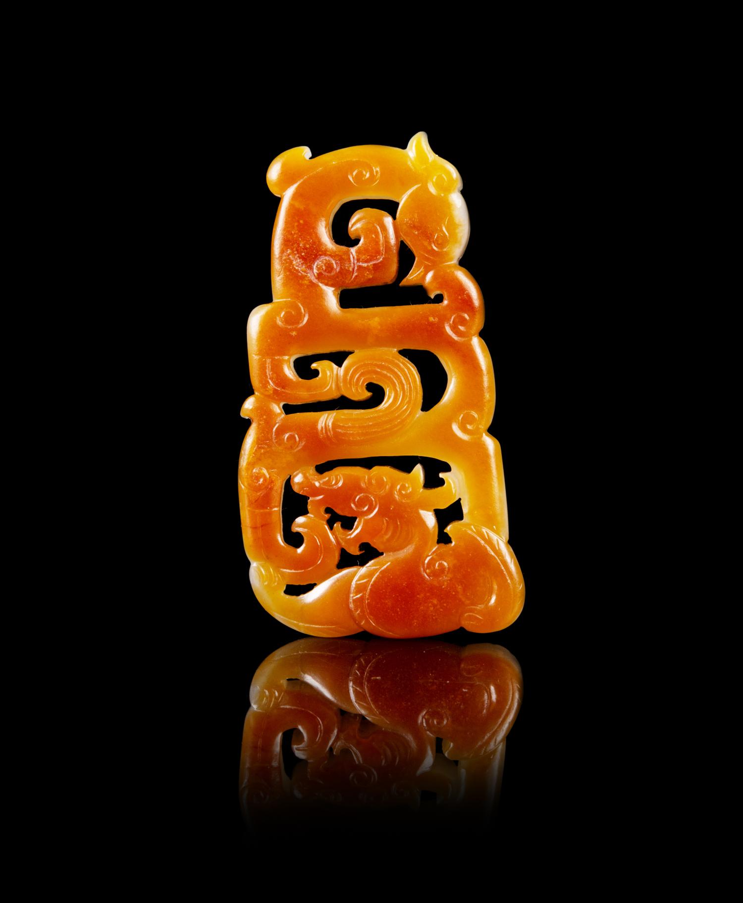 A Chinese Russet and White Jade Reticulated Pendant