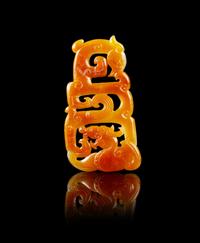 A Chinese Russet and White Jade Reticulated Pendant