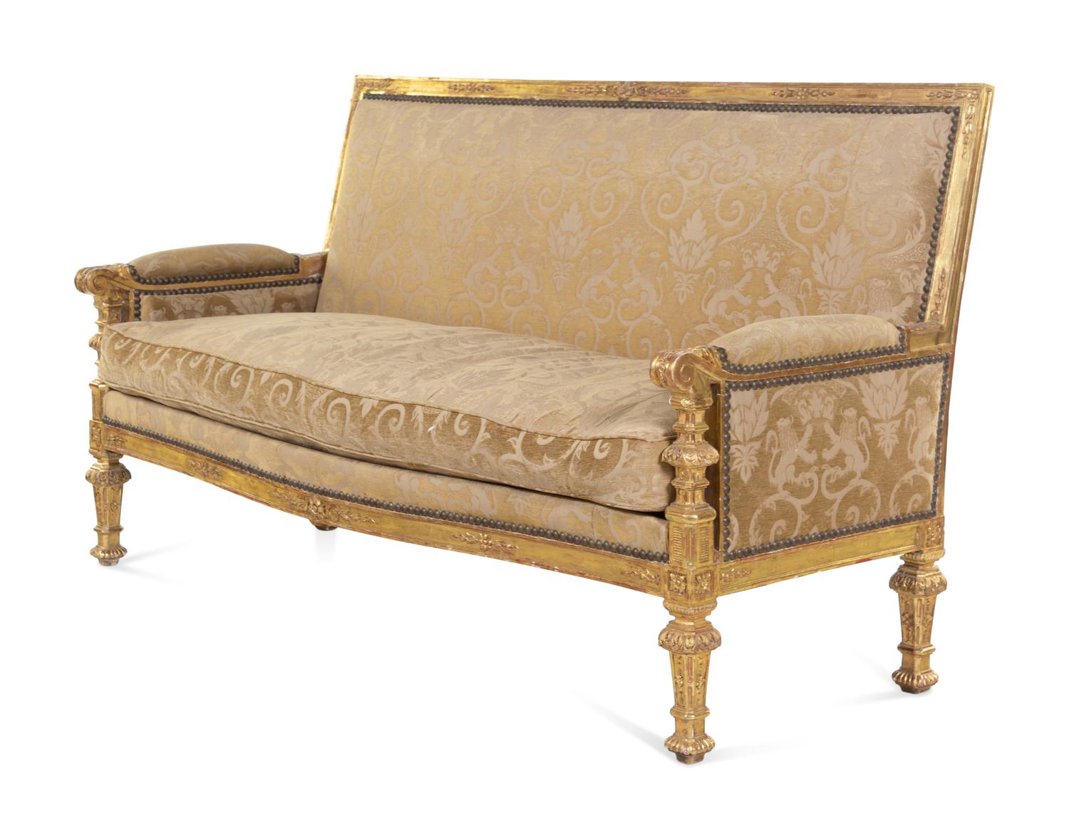 A Pair of Régence Style Carved Giltwood Sofas