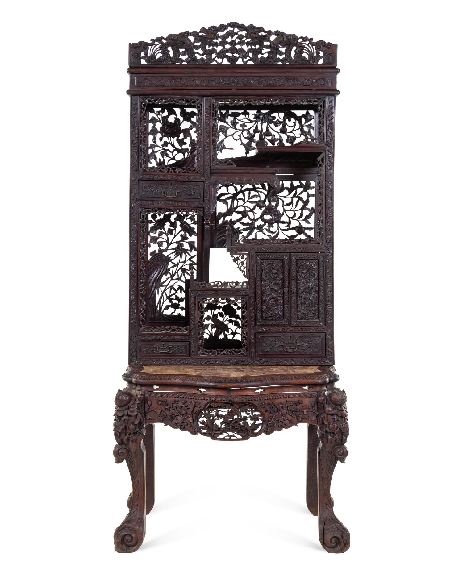 A Chinese Export Carved Hardwood Displaying Cabinet and Desk