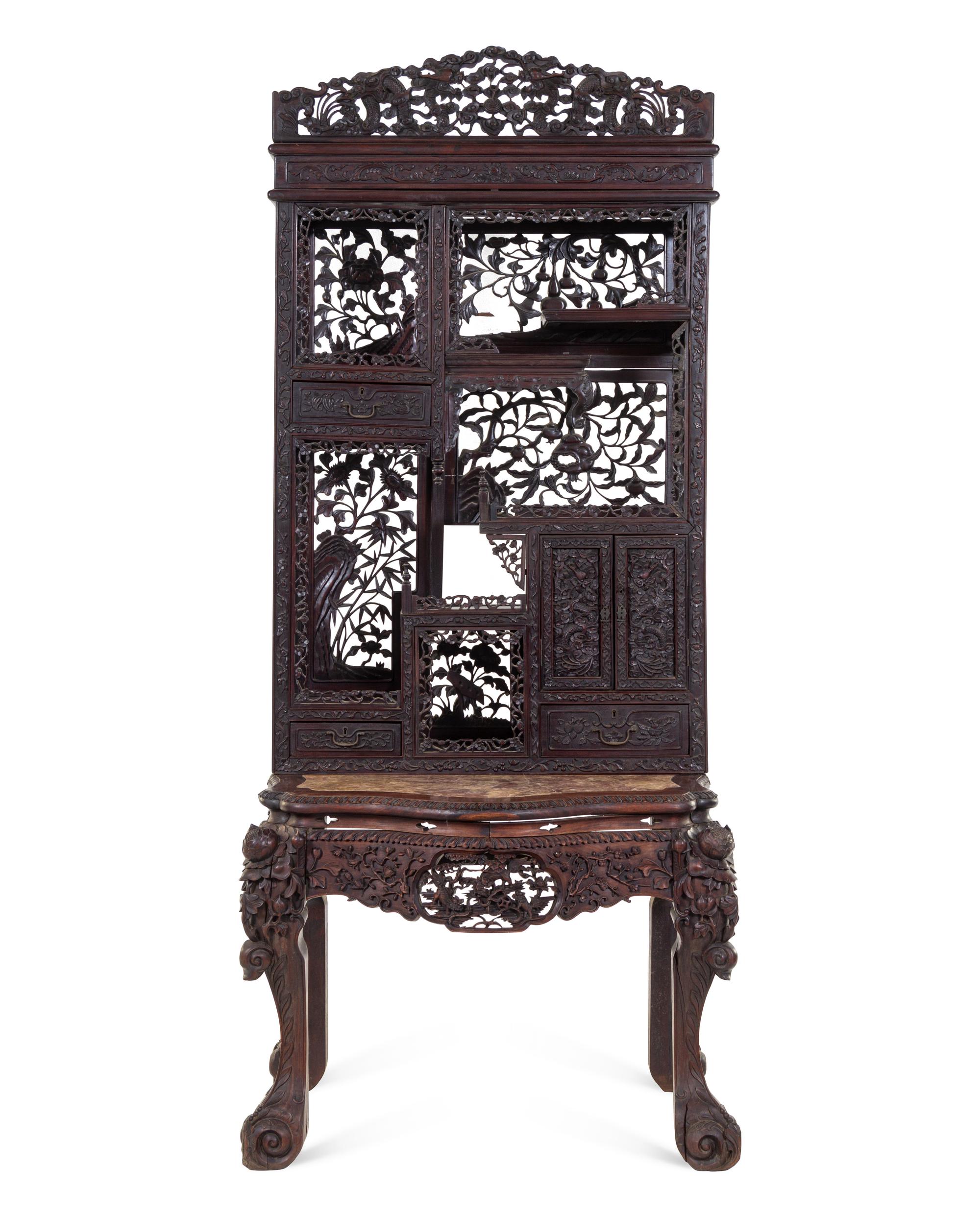 A Chinese Export Carved Hardwood Displaying Cabinet and Desk