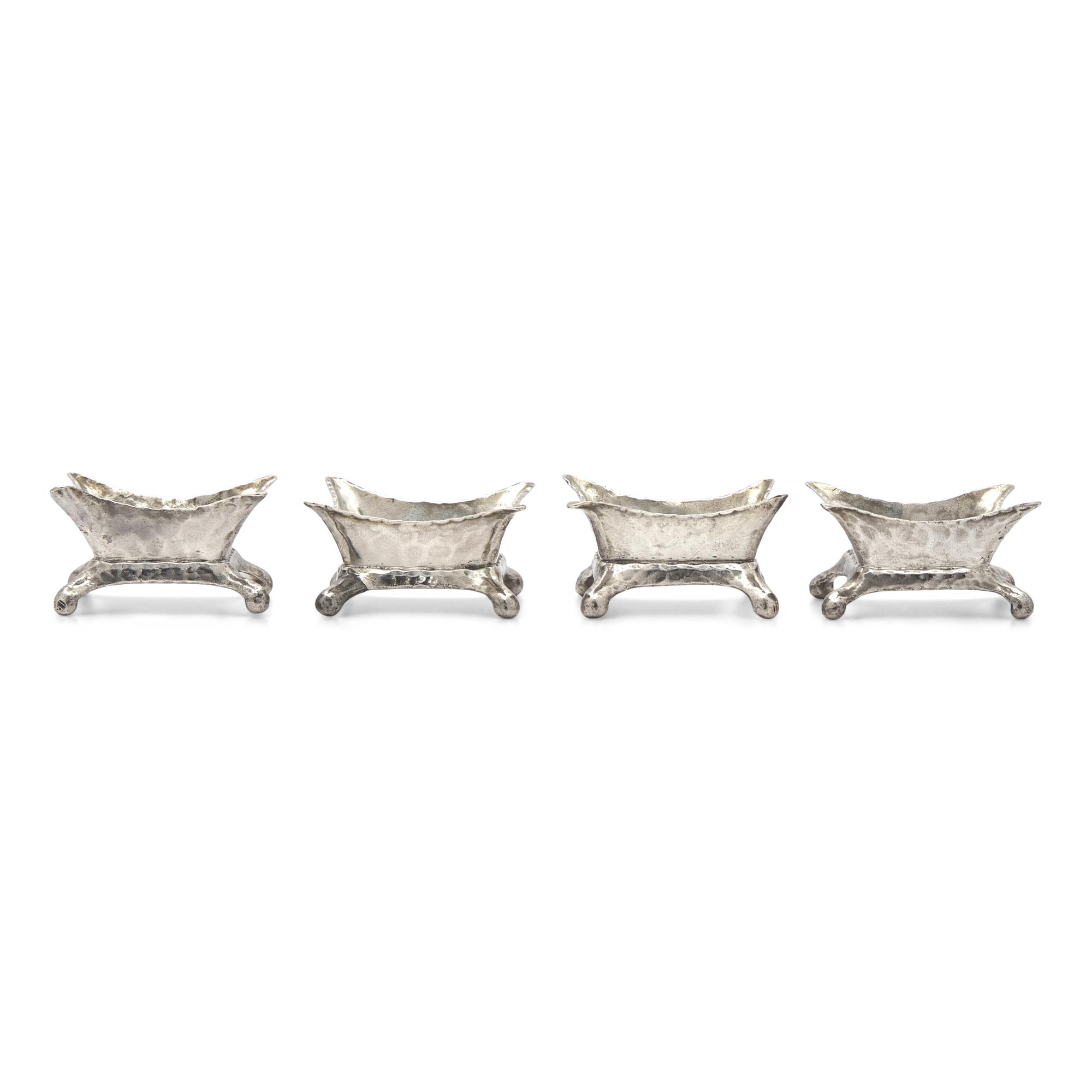 A Set of Four Aesthetic Movement Hammered Sterling Silver Salt Cellars