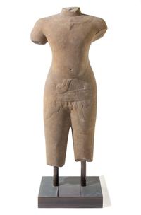 A Khmer Baphuon-Style Limestone Torso of Vishnu Height 43 inches. — ANGKOR WAT STYLE, 11TH CENTURY