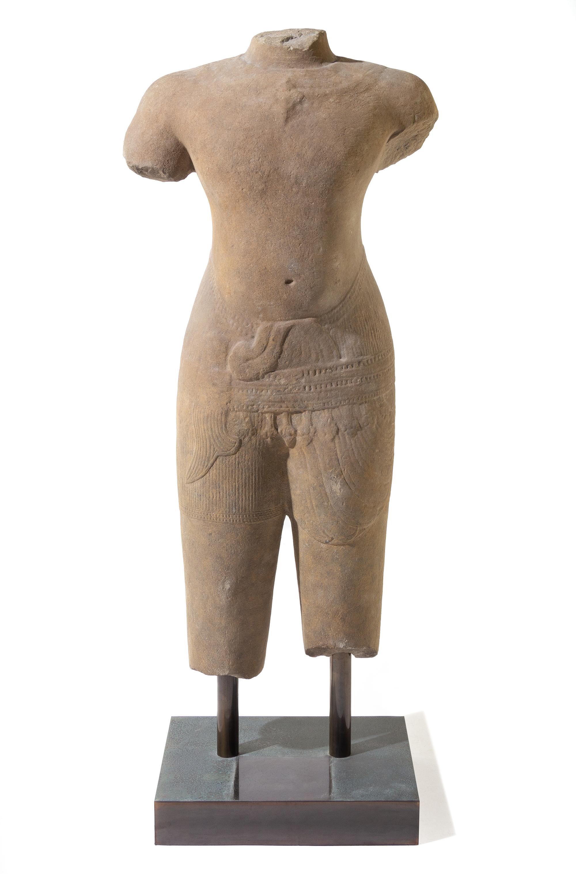 A Khmer Baphuon-Style Limestone Torso of Vishnu Height 43 inches. — ANGKOR WAT STYLE, 11TH CENTURY