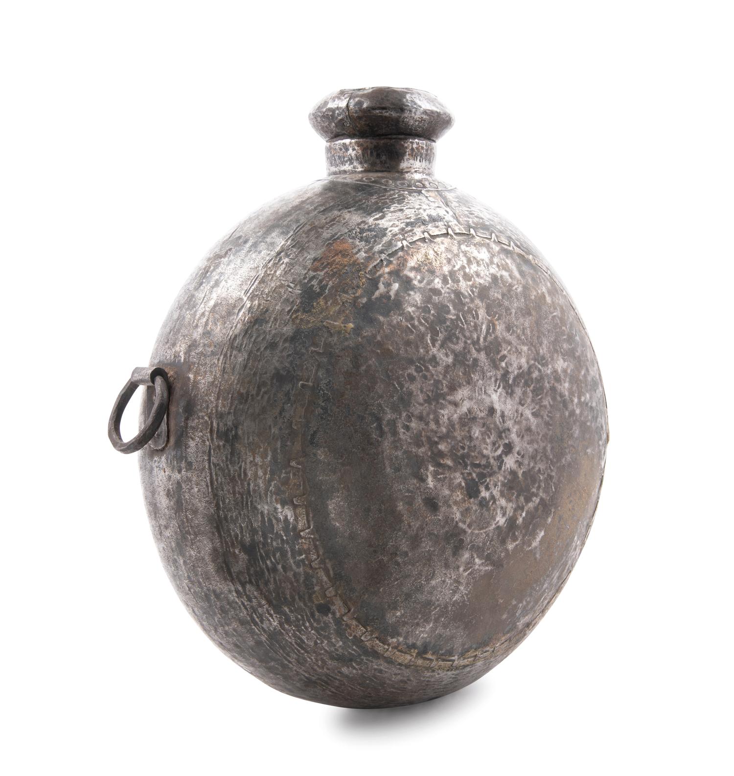 A Large Indonesian Hammered Metal Vessel