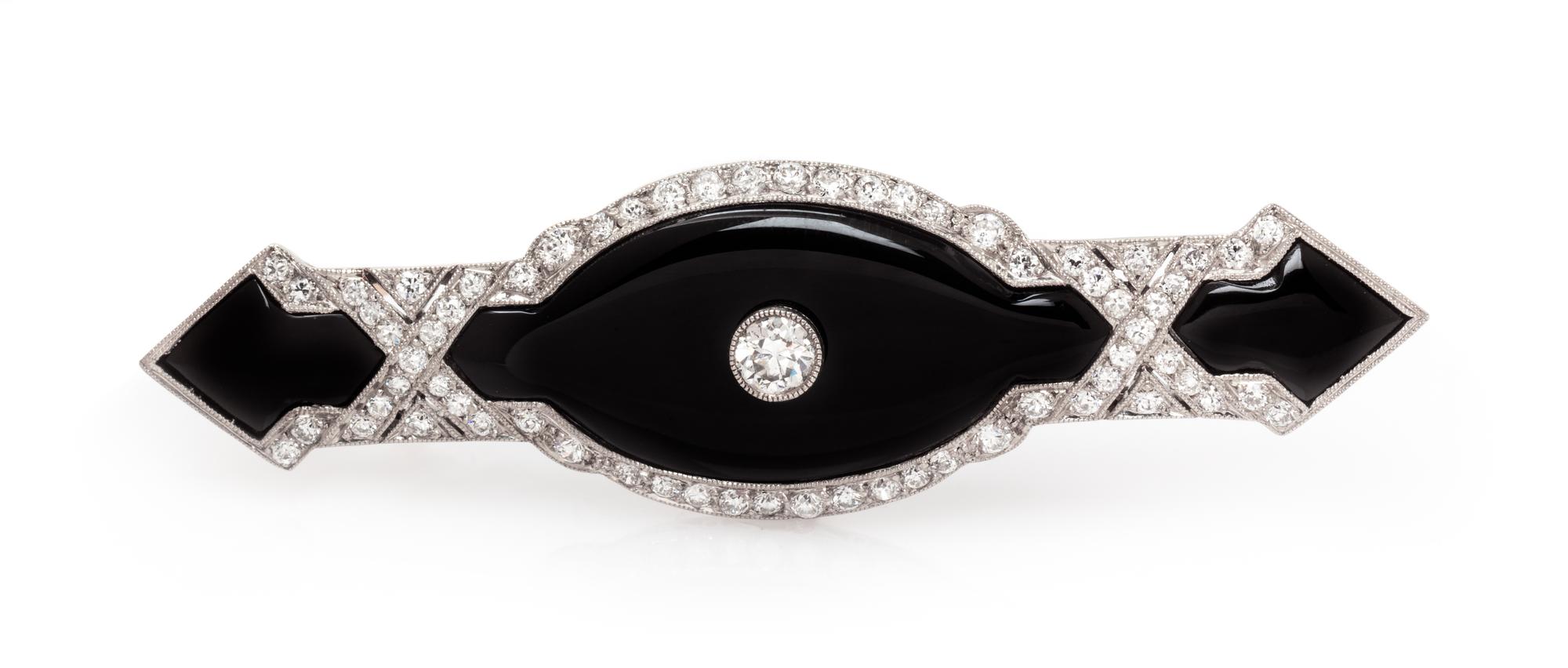 An Art Deco Platinum, Onyx and Diamond Bar Brooch, 6.40 dwts.