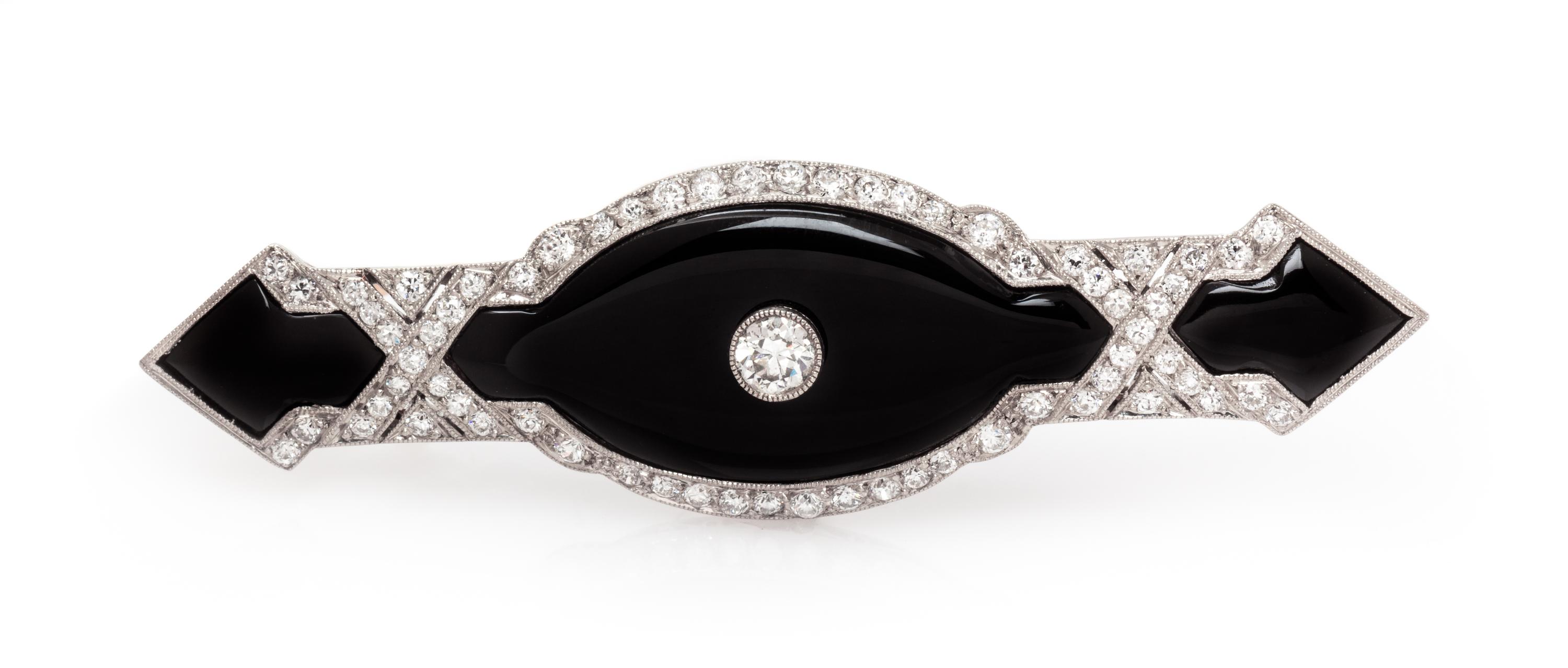 An Art Deco Platinum, Onyx and Diamond Bar Brooch, 6.40 dwts.