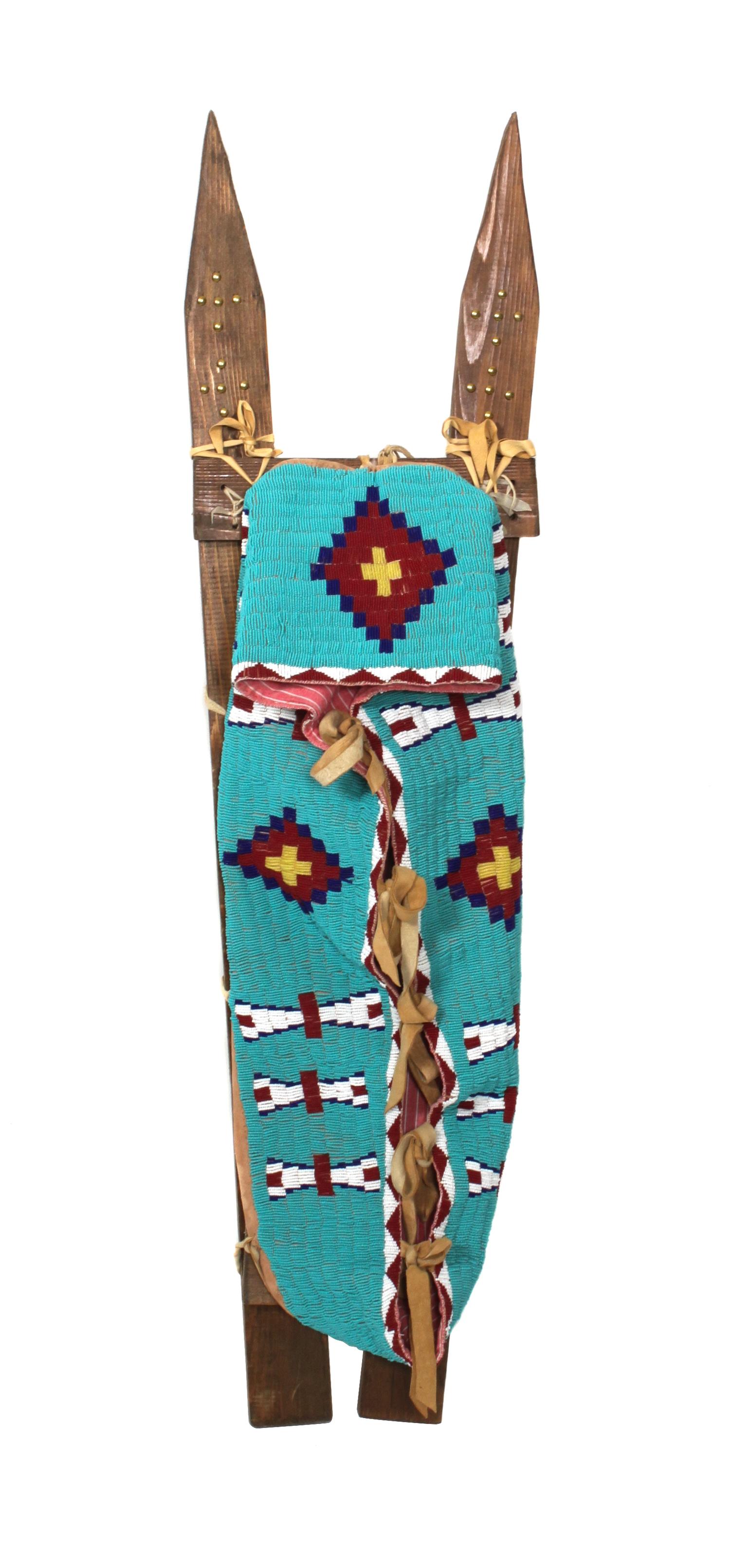 A Northern Plains Style Beaded Cradle on Tacked Slats length overall 42 inches