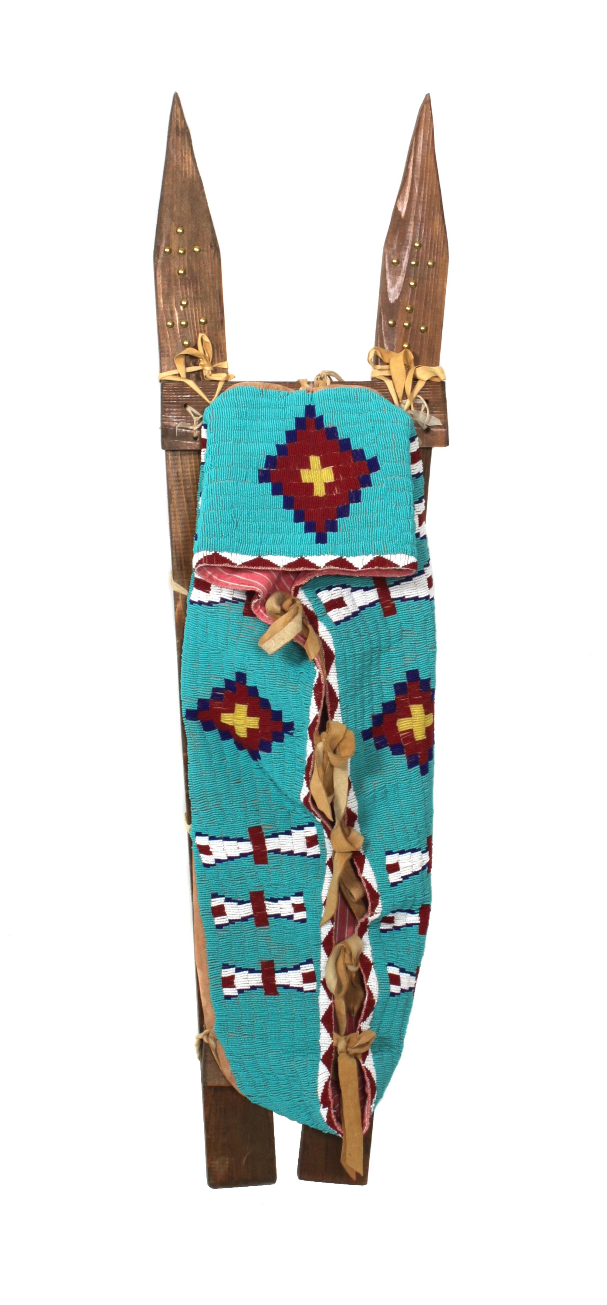 A Northern Plains Style Beaded Cradle on Tacked Slats length overall 42 inches