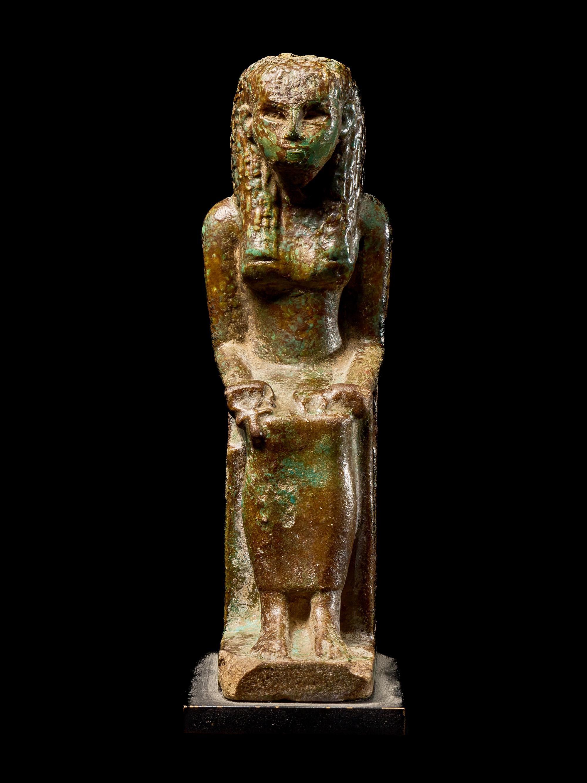 An Egyptian Faience Enthroned Queen or Goddess
