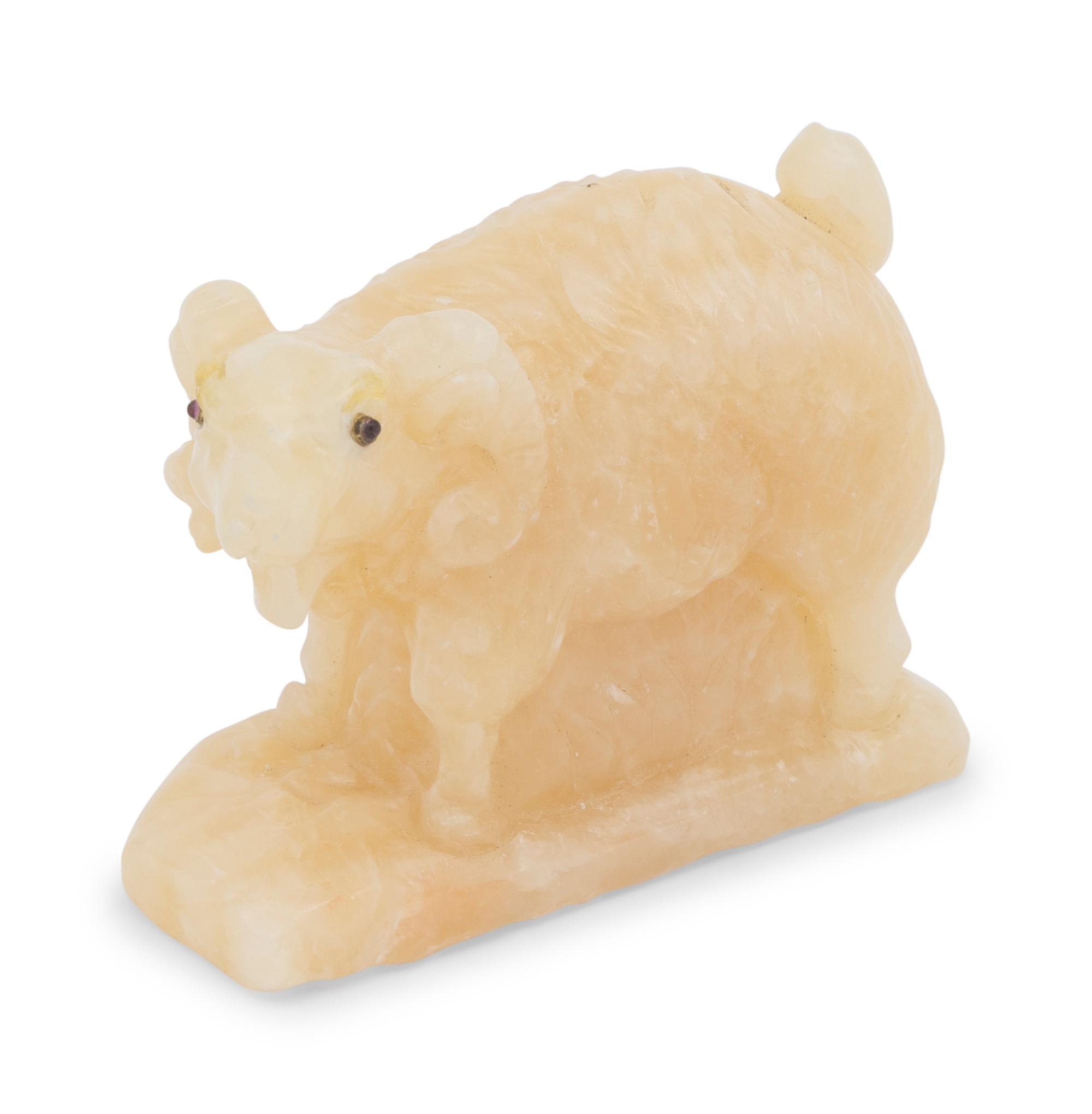 A Ruby-Inset Carved Hardstone Ram Figure