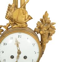 A Louis XVI Style Gilt Bronze Cartel Clock