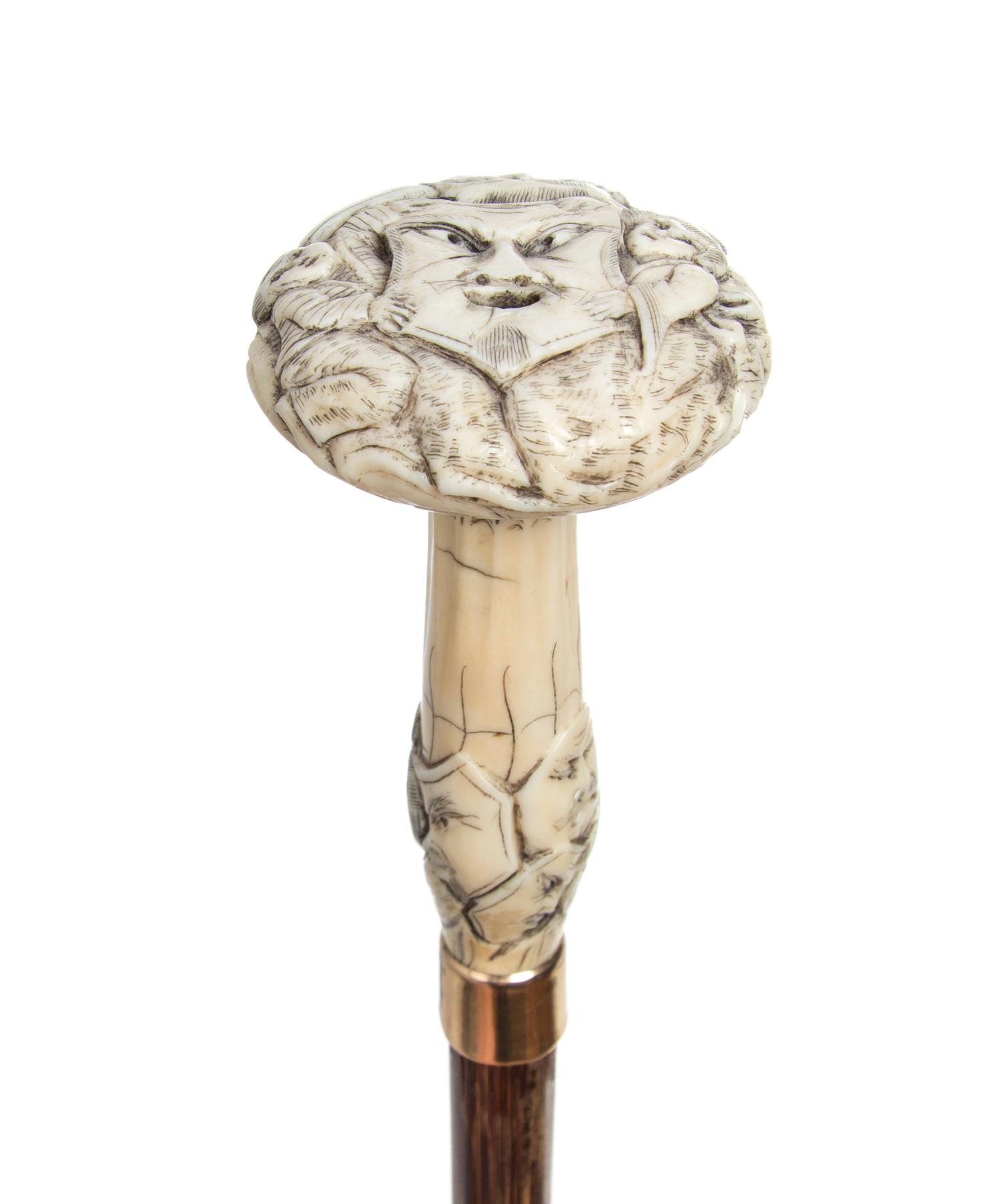 A Japanese Ivory Handled Cane, Length of handle 4 x length overall 36 1/2 inches.
