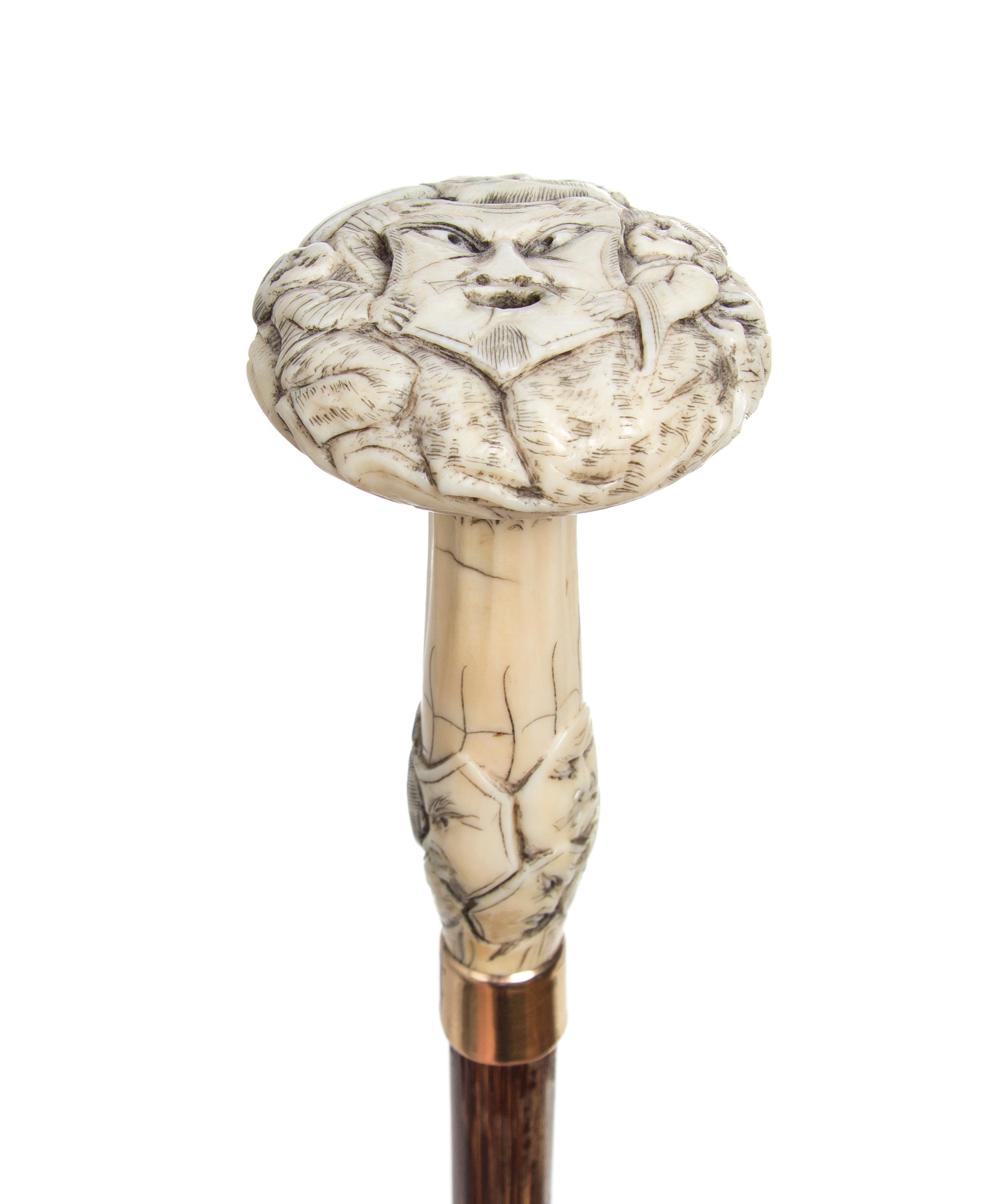 A Japanese Ivory Handled Cane, Length of handle 4 x length overall 36 1/2 inches.
