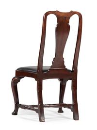 A Queen Anne Carved Walnut Compass-Seat Stretcher-Base Side Chair
