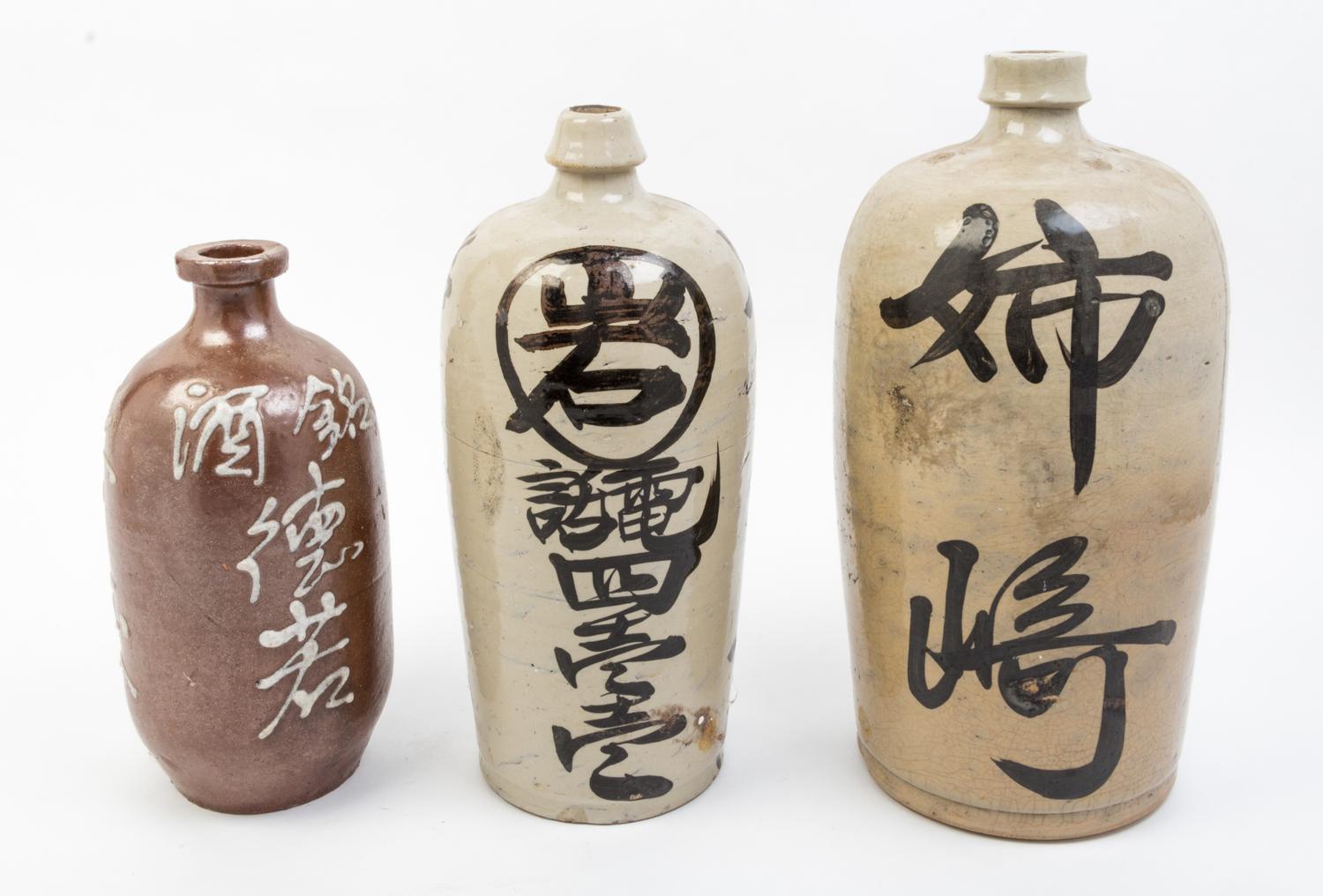 Three Glazed Pottery Bottles Height of tallest 15 inches.