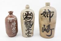 Three Glazed Pottery Bottles Height of tallest 15 inches.