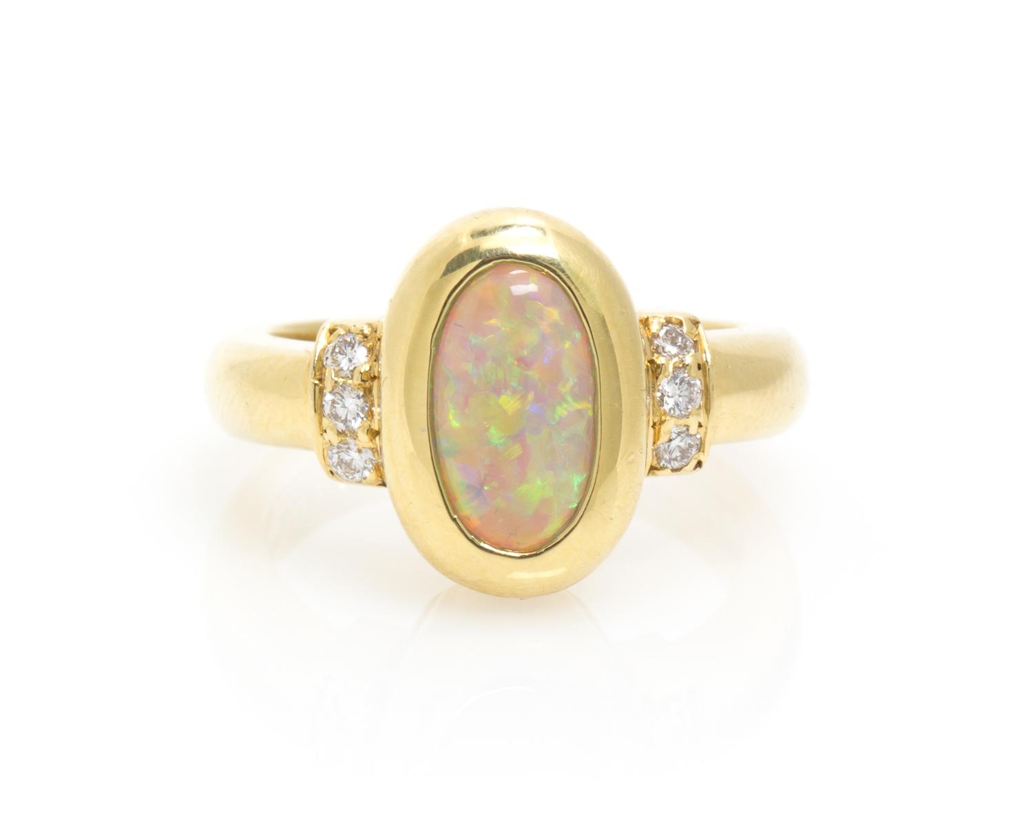 An 18 Karat Yellow Gold, Opal and Diamond Ring, 5.90 dwts.