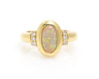 An 18 Karat Yellow Gold, Opal and Diamond Ring, 5.90 dwts.