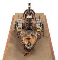 A Model of the Side Wheel Tug Munchen Height of model 14 x length of base 58 5/8 inches.