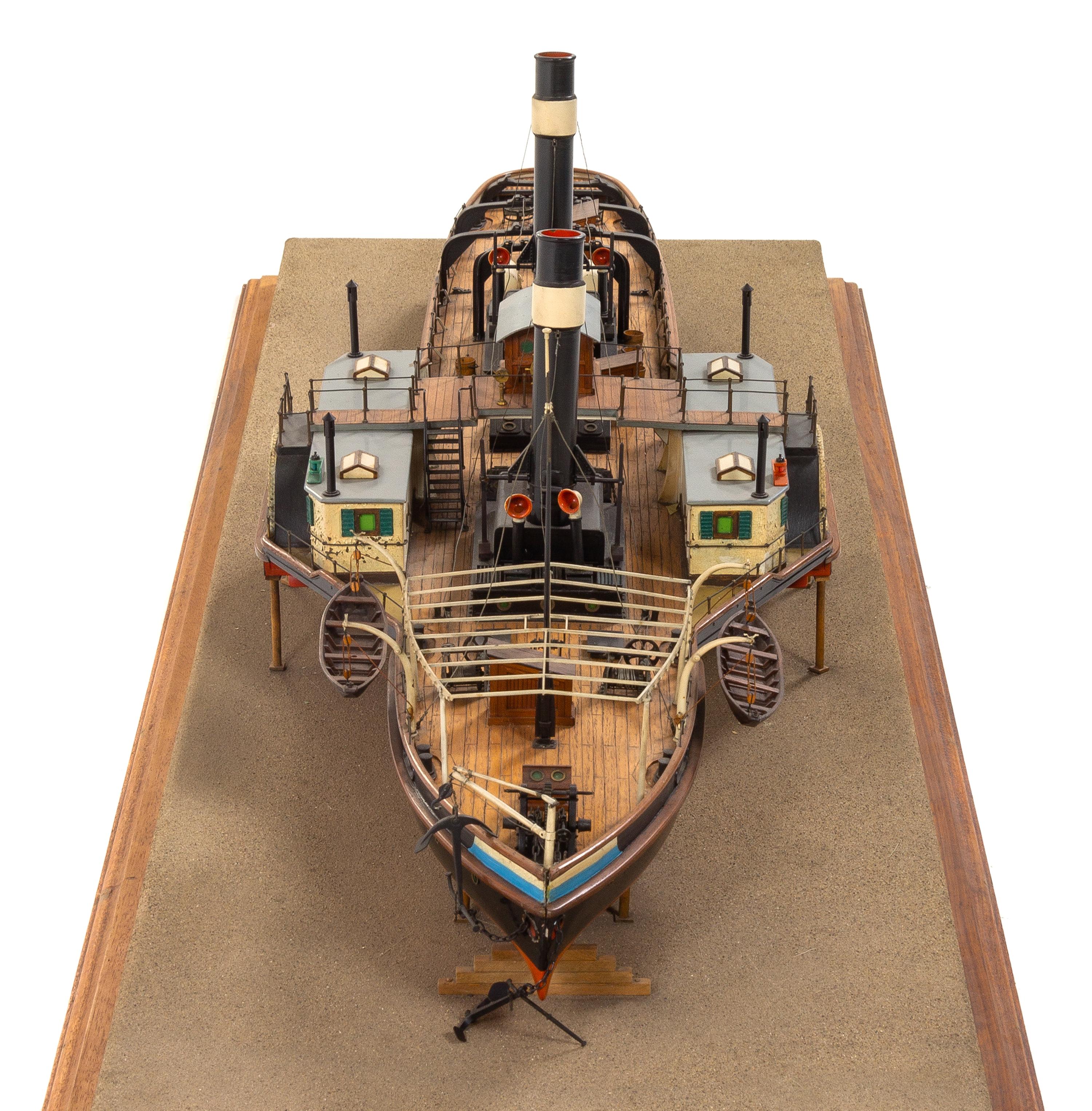 A Model of the Side Wheel Tug Munchen Height of model 14 x length of base 58 5/8 inches.
