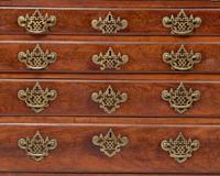 A Chippendale Figured and Carved Walnut Desk-and-Bookcase