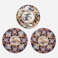 Three Massive Imari chargers The pair Meiji period, the third circa 1700-1725