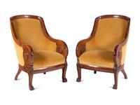 A Pair of Baltic Style Carved Walnut Bergères