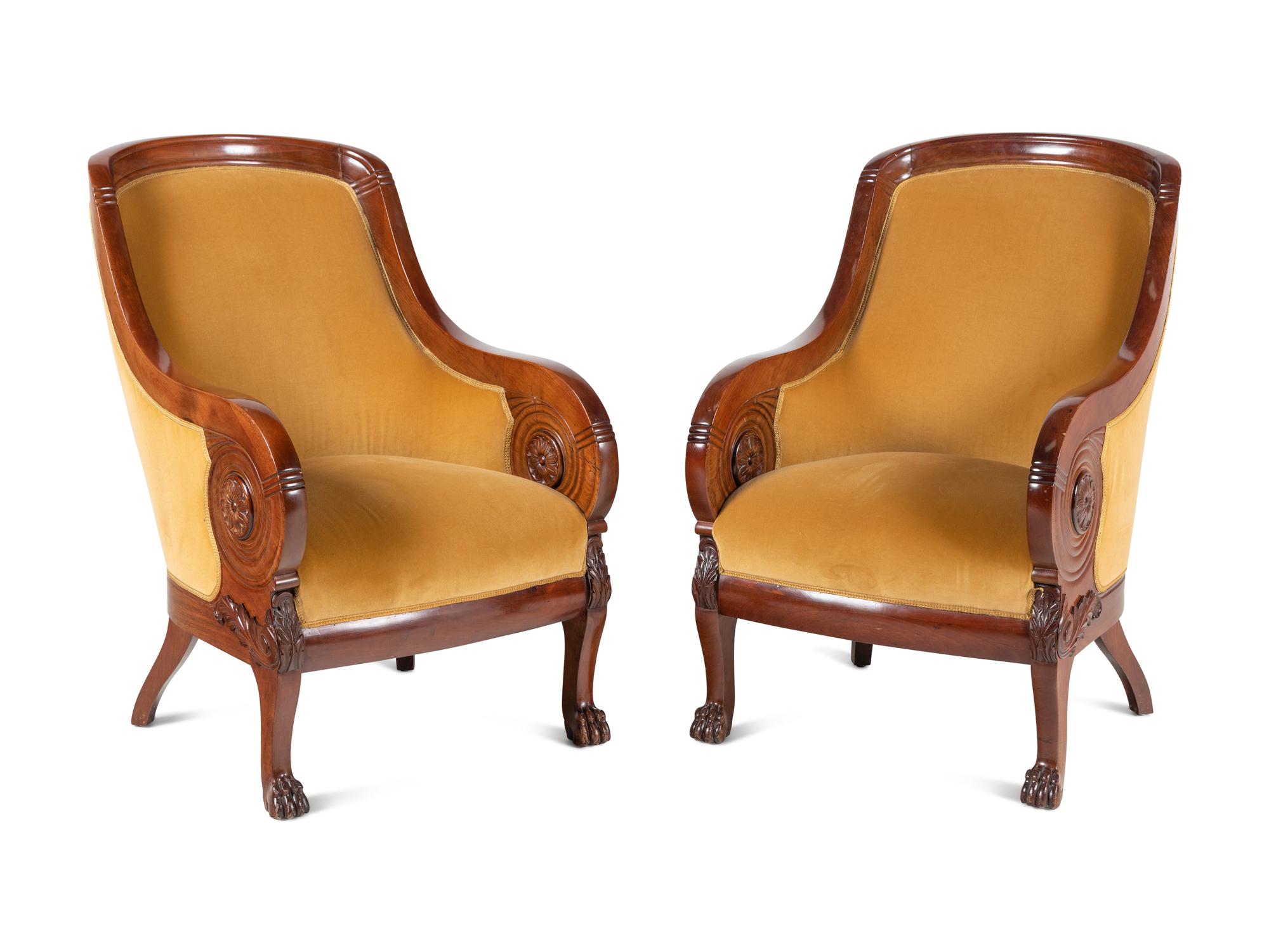 A Pair of Baltic Style Carved Walnut Bergères