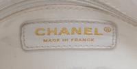 A Chanel White Caviar Leather Handbag, 14" x 8" x 5".