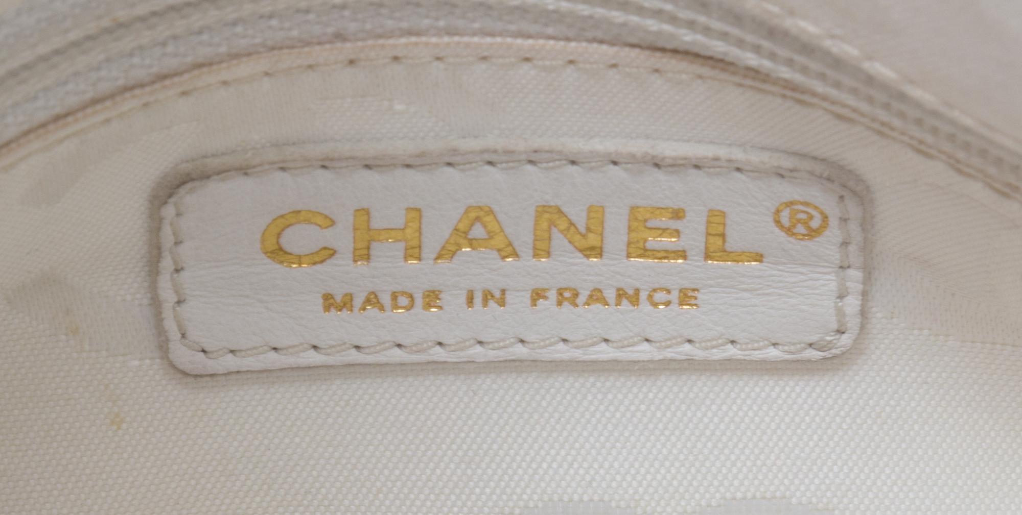 A Chanel White Caviar Leather Handbag, 14" x 8" x 5".