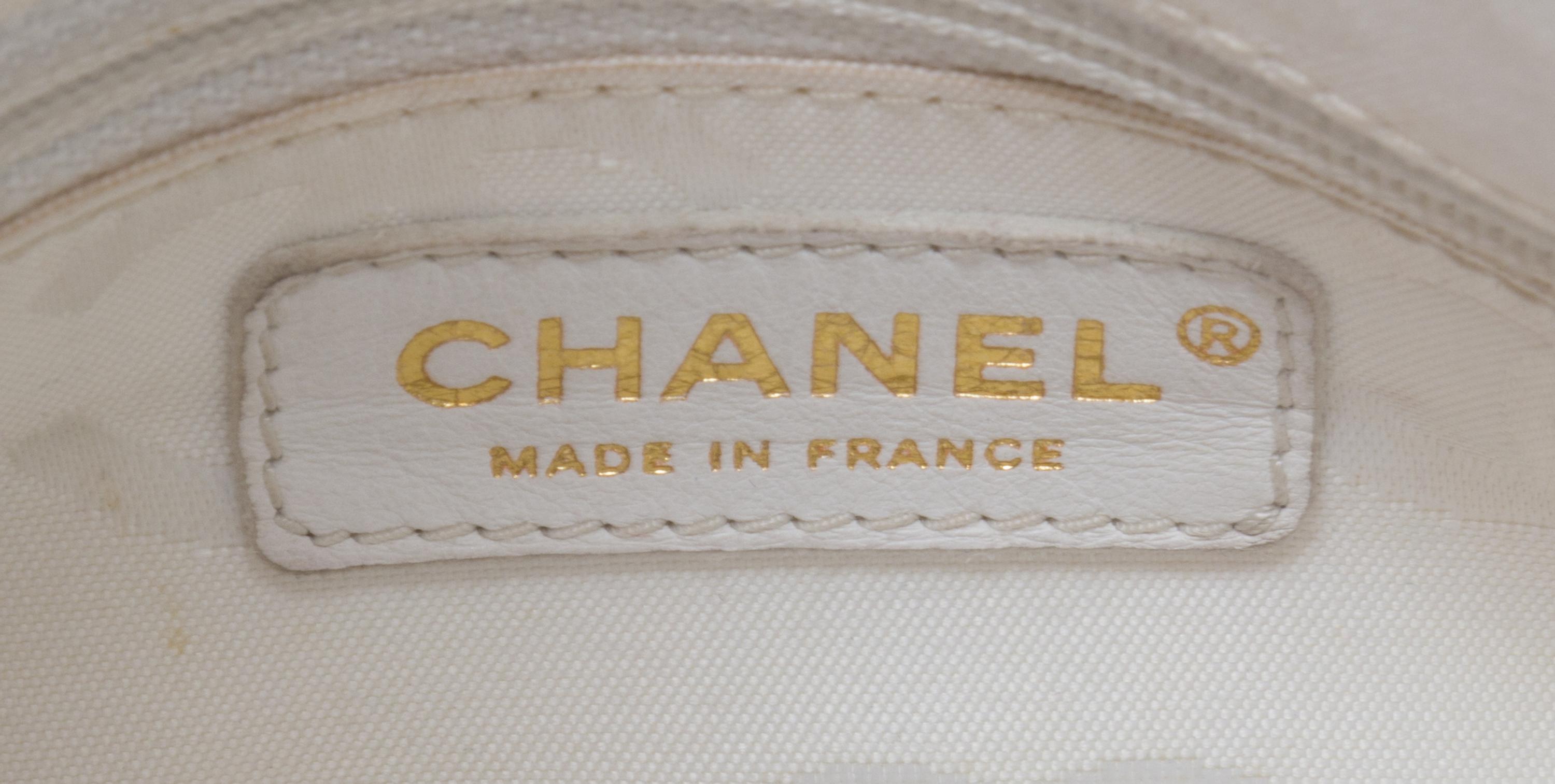 A Chanel White Caviar Leather Handbag, 14" x 8" x 5".
