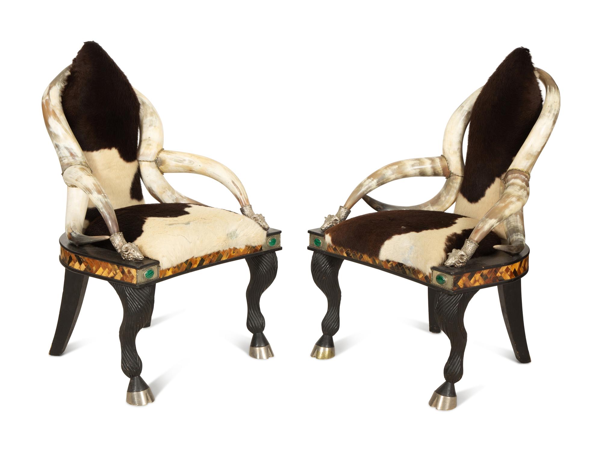 A Pair of Anthony Redmile Longhorn Chairs with Cow Hide Upholstery