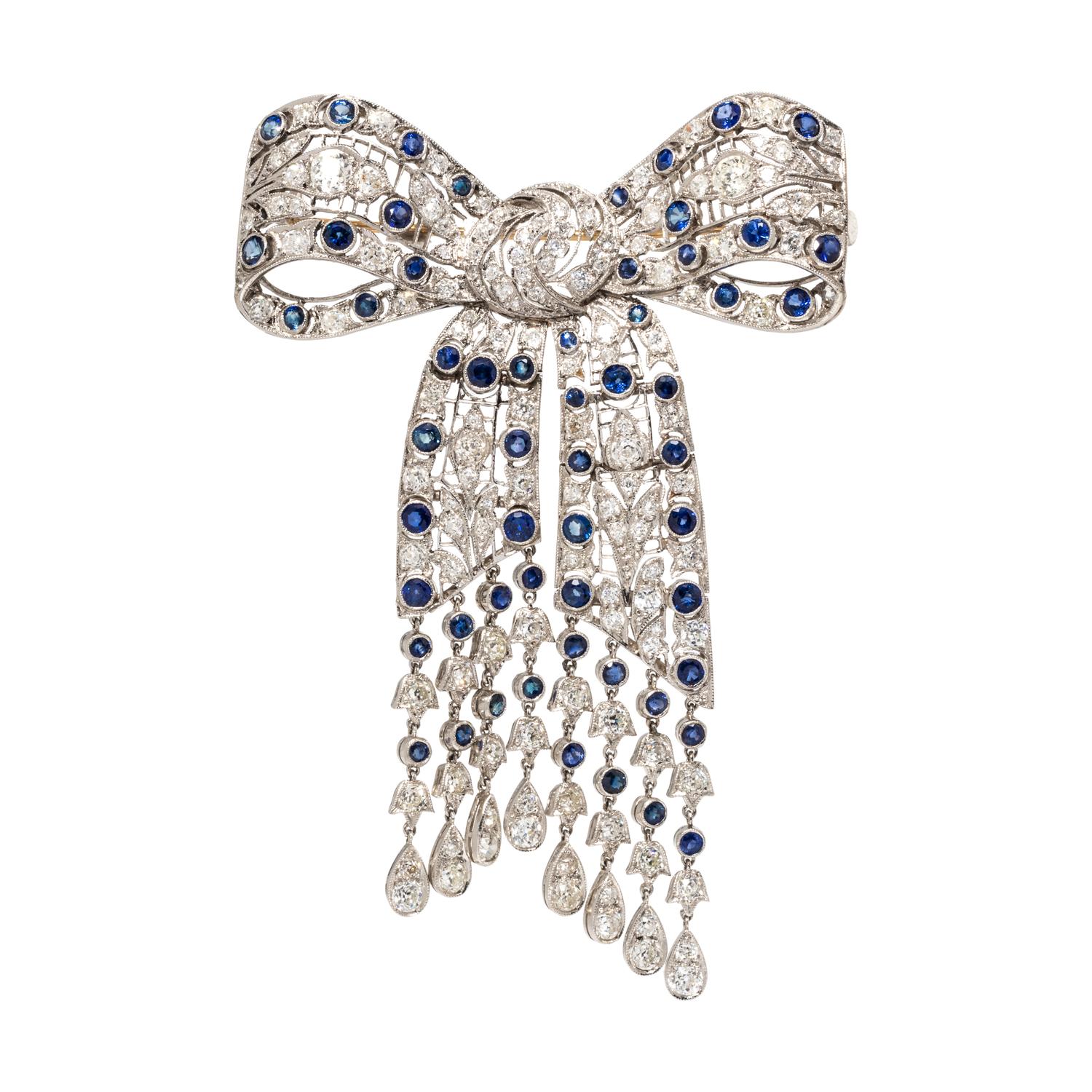 EVELYN CLOTHIER, DIAMOND AND SAPPHIRE BOW BROOCH